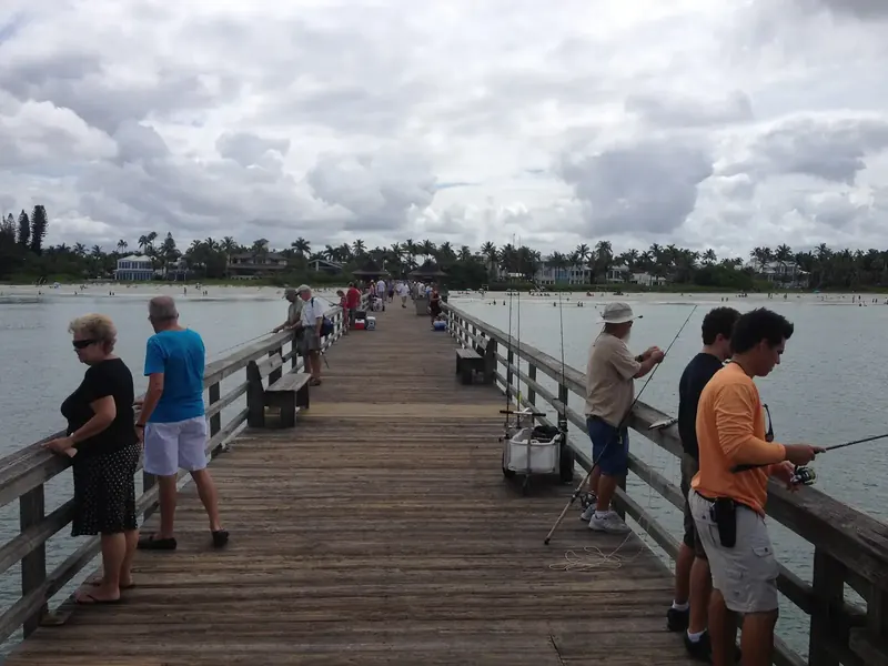 The historic Naples Pier on the Gulf beach in Naples, Florida