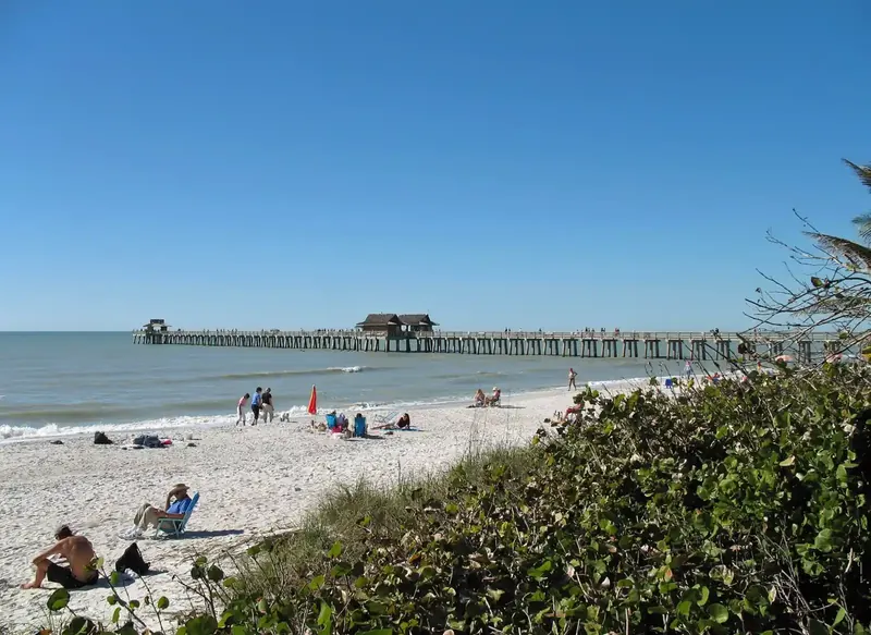 Naples insurance for homes near the Gulf: the Naples Pier stretching out over the water from the city beach